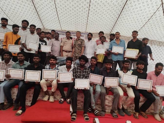 Youth holding certificates after completing their training